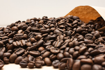 Coffee beans. Coffee beans are spread out on the surface.
