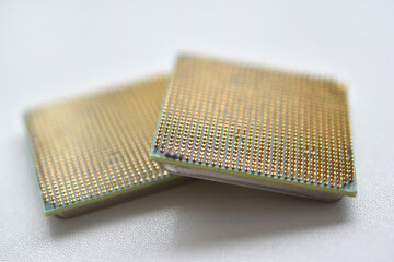 Computer processor with contact legs on a white background