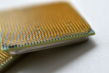 Computer processor with contact legs on a white background