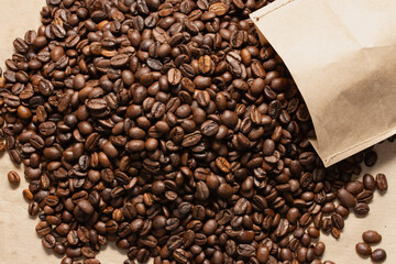 Coffee beans. Coffee beans are spread out on the surface.