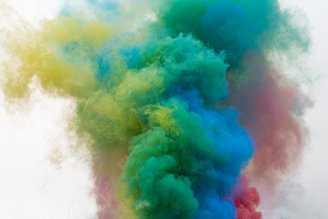 Blended rainbow color smoke bombs (smoke grenades). Colourful smoke in the air