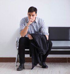 Man nervously impatiently waiting in the lobby