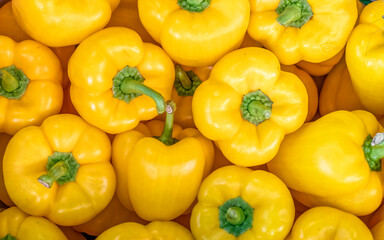 vivid yellow bell peppers top view closeup, natural, colorful pattern background