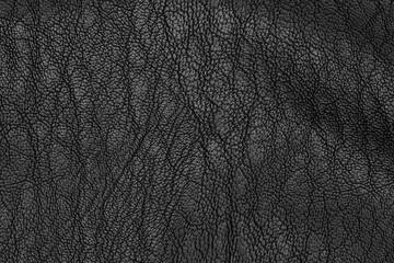 Artificial black leather (synthetic leather) texture detail. The solid pattern for background