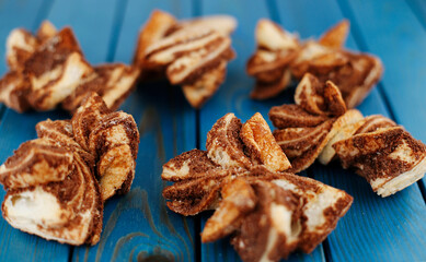 Cinnamon cookies on a blue wooden background. Homemade cakes.