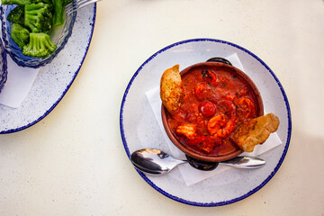 Directly above view of tomato soup with shrimps