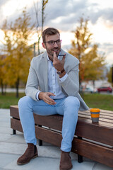 Obraz premium Portrait of a young businessman talking on the phone. 