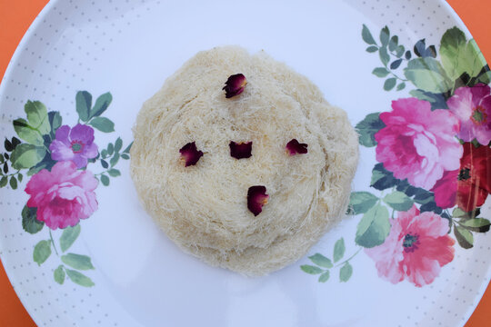 Indian traditional sweet dish Sutarfeni is shredded, flaky, rice-flour roasted in ghee clarified butter. melted in sugar like cotton candy. Gujarati sweets for festivals