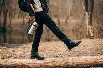 a walk in the woods with a thermos