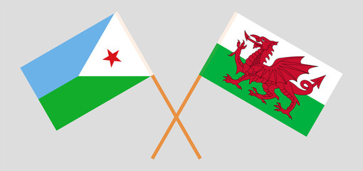 Crossed flags of Djibouti and Wales. Official colors. Correct proportion