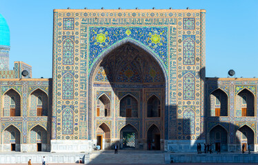 Iwan and pishtaq of Tilya-Kori Madrasah located in the Registan, Samarkand in Uzbekistan. Tilya...