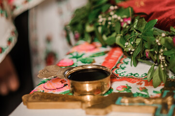 Red wine in a bowl in a church