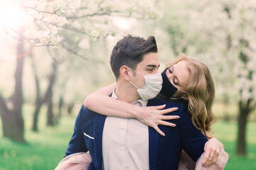 Newlyweds after marriage registration in masks, during a coronavirus infection