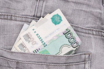Paper 1000 banknotes of russian rubles in a jeans pocket, inflation rate concept
