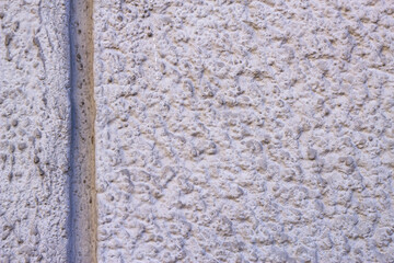 Plastered rough wall texture. City surface background. Grey decorative textured backdrop.