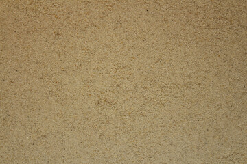 Fototapeta na wymiar Sand background and texture. Top view of natural structured sandy beach surface.