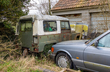 old abandoned cars suitable for restoration.