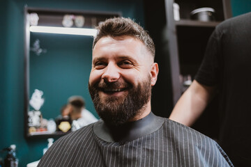 Portrait of happy young man with beard