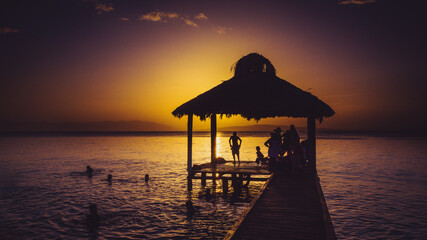 Sunset on a Caribbean beach pier