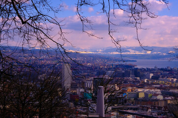 an evening cityskape with Zurich lake in the background