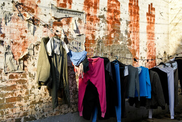 Fototapeta na wymiar Laundry hangs outside to dry on a sunny day in the ancient town of Daxu, Guangxi Province, China.