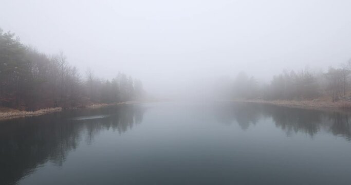 fog over mountain lake, 4k video