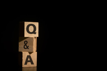 Wooden blocks written with Q&A. Business concept.