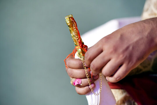 Indian Groom Holding A Wedding Knife Kirpan