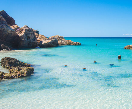 A beautiful turquoise cove on the Isla de Cajo de Muertos in the Caribbean Sea 10 miles off the coast of Ponce, Puerto Rico, USA.  Copy space.