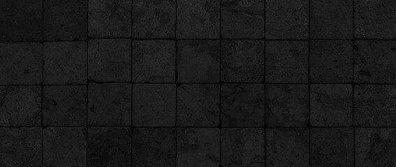Panorama of Building exterior black granite block wall texture and background seamless