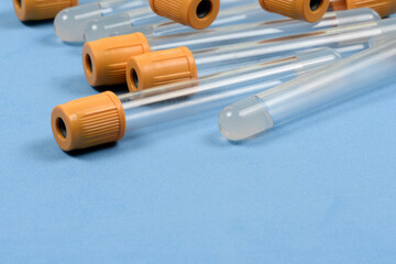 empty vacuum tube for blood collection on blue background