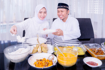 Happy young couple having dinner during Eid Mubarak