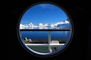 View of the Antarctic Peninsular from an expedition cruise vessels cabin porthole