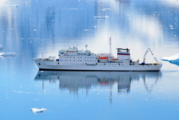An Antarctic cruise ship waiting in Paradise Harbour for tourists ashore on an expedition