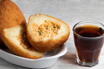Delicious traditional Brazilian snack, coxinha of chicken.