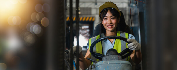 Asian beautiful woman driver drive fork  lift car in industry with smiled, ability of girl and...