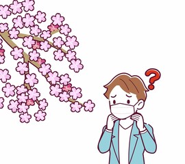 マスクをしたまま花見をする人