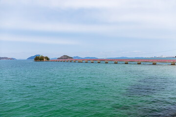 Japanese shrine and red bridge in the seto inland sea , Mitoyo city, Kagawa, Shikoku, Japan
