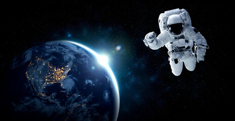 Astronaut spaceman do spacewalk while working for space station in outer space . Astronaut wear full spacesuit for space operation . Elements of this image furnished by NASA space astronaut photos. © InfiniteFlow