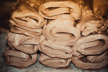 Wet white clay closeup. Abstract pieces of wet clay on the table