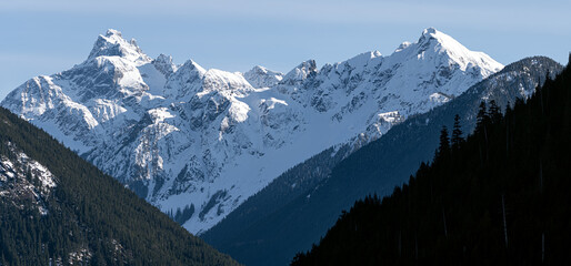 Close up photo at snowy mountain peaks of Mt. Redoubt and Mt. Nodoubt at Chilliwack Lake, Canada, British Columbia