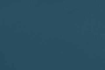Blue homogeneous background with a textured surface