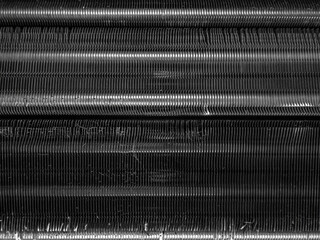 air conditioner evaporator coils panel with dust contaminated and bent fins before maintenance and...