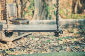 wooden swing in garden