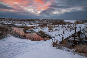 wooden bridge over the stream