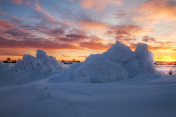 snowy field at sunset