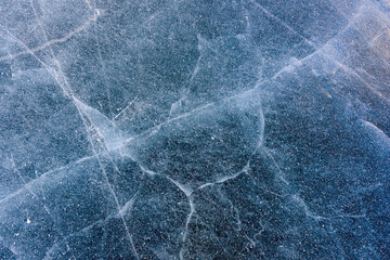 Beautiful ice of Lake Baikal with abstract cracks
