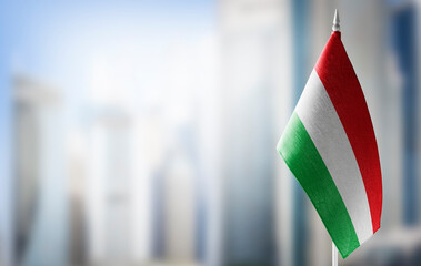 Fototapeta na wymiar A small flag of Bulgaria on the background of a blurred background