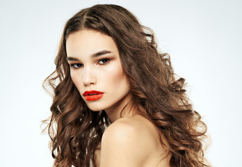 Fototapeta premium Side view of lady with curly hair red lips