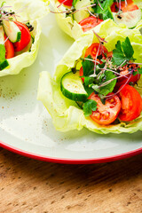 Plate of salad with vegetables and green